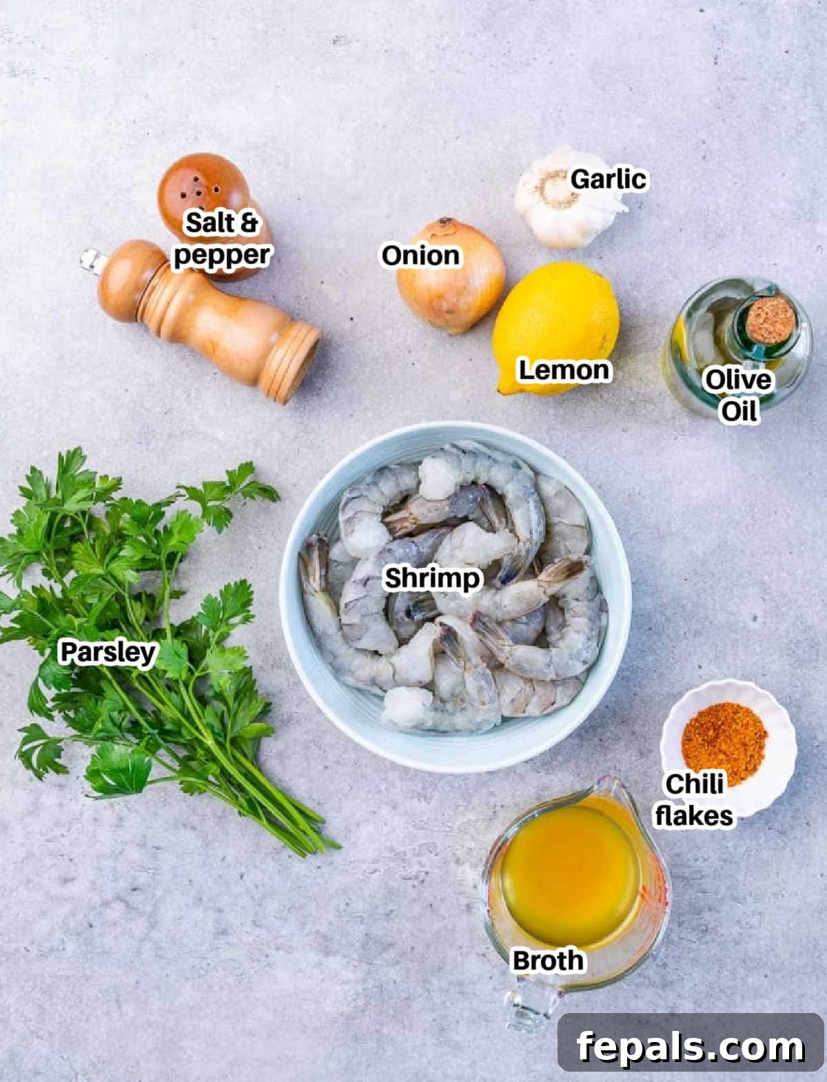 Guilt-Free Garlic Shrimp Scampi 4 ingredients to make shrimp scampi laid out on a table