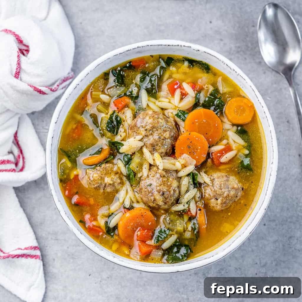 Nonna's Italian Wedding Soup 2 top view of italian wedding soup in a white bowl