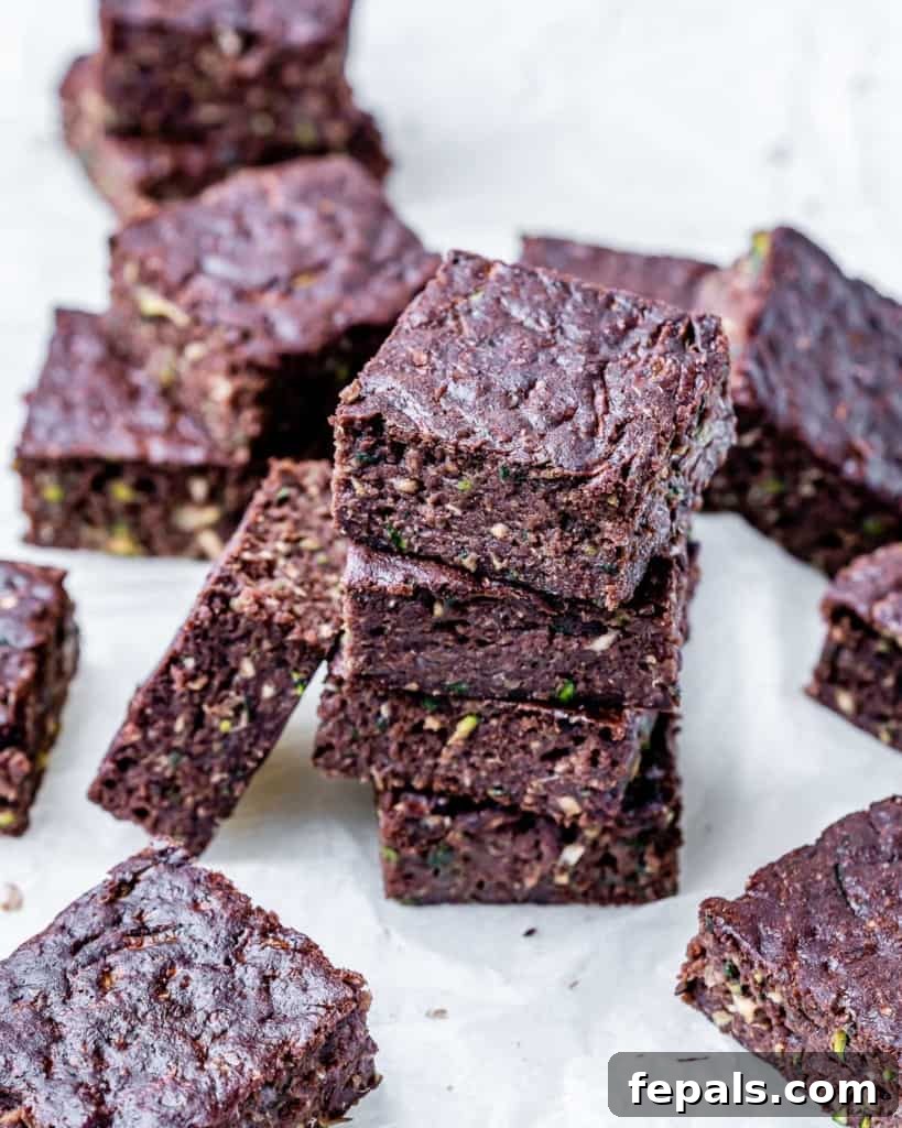 A beautifully arranged stack of chocolate brownie bars, highlighting their appealing texture and rich color.