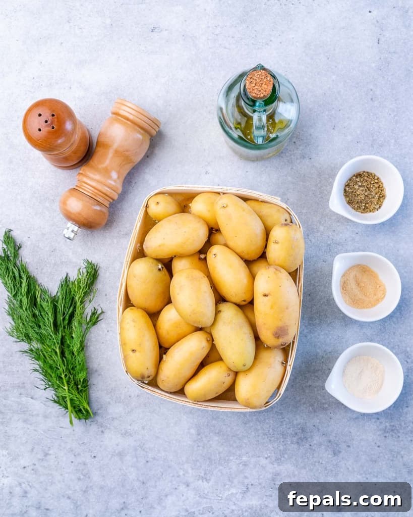 Lemon Herb Greek Baked Fingerlings 4 Fingerling potatoes in a bowl with seasonings divided into small bowls.
