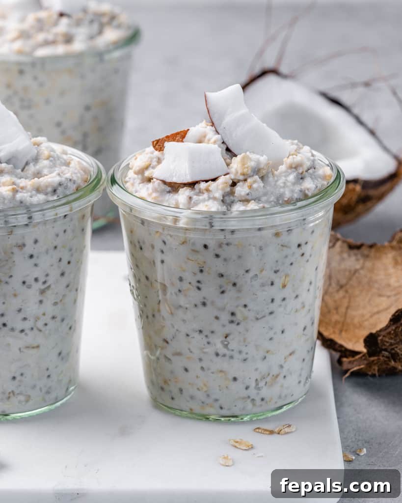 Coconut Cream Pie Dream Oats 2 Overnight oatmeal in a jar and topped with coconut chunks.