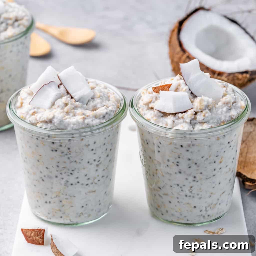 Coconut Cream Pie Dream Oats 3 side shot image of 2 jars of overnight oats topped with fresh coconut