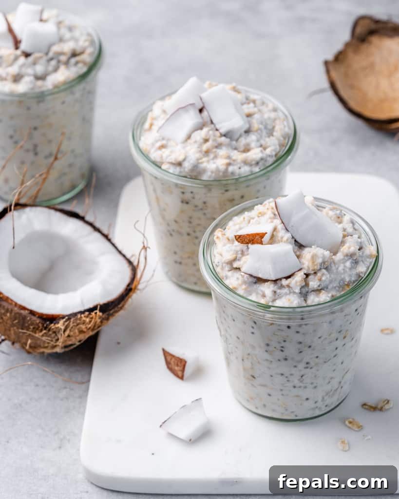 Coconut Cream Pie Dream Oats 7 side shot of overnight oats in a jar on a white marble board