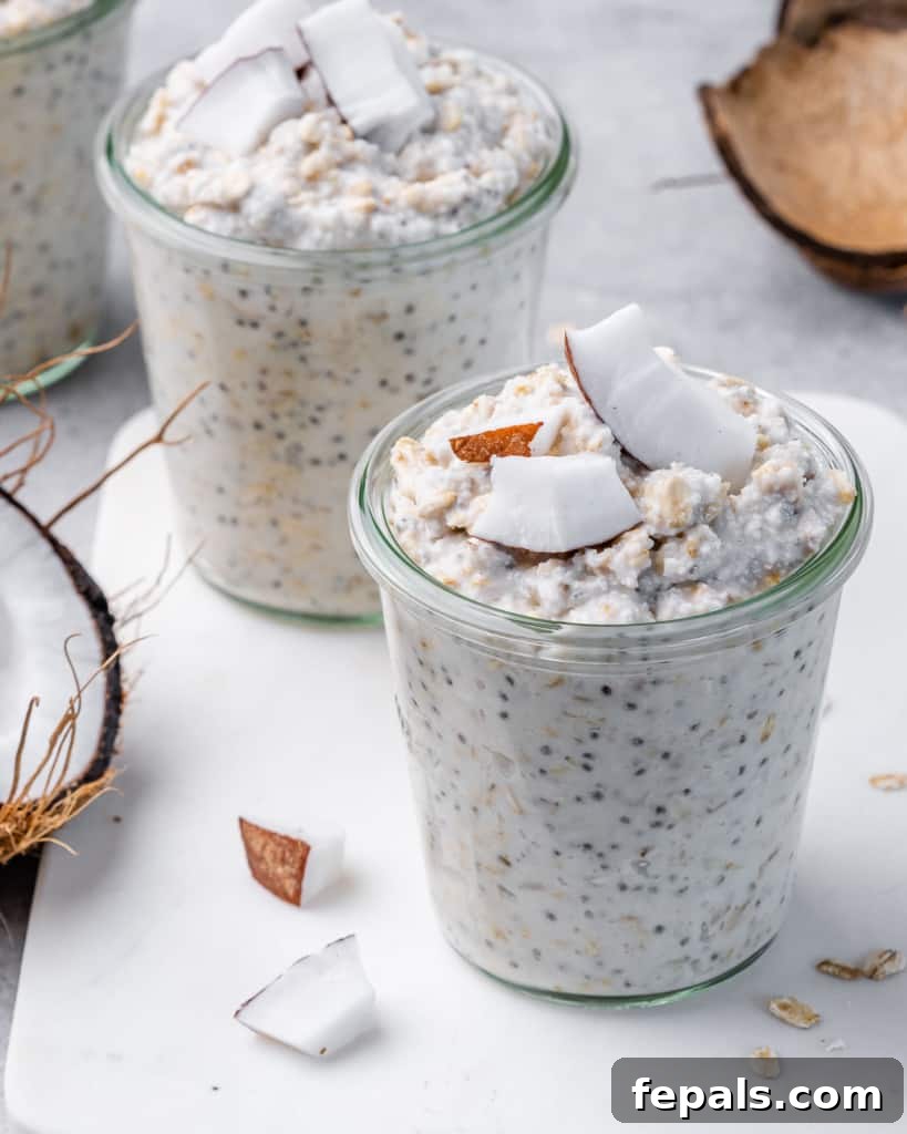 Coconut Cream Pie Dream Oats 10 side shot of a jar with overnight oats topped with fresh coconut