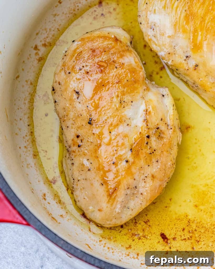 Hearty Chicken and Garden Vegetable Soup 5 Seared chicken browning in a Dutch oven.