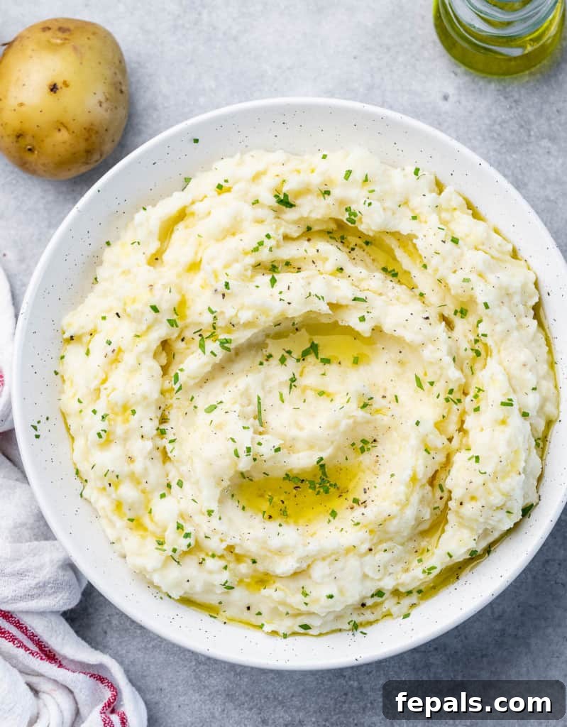 top view mash potato on a white plate, simply presented.