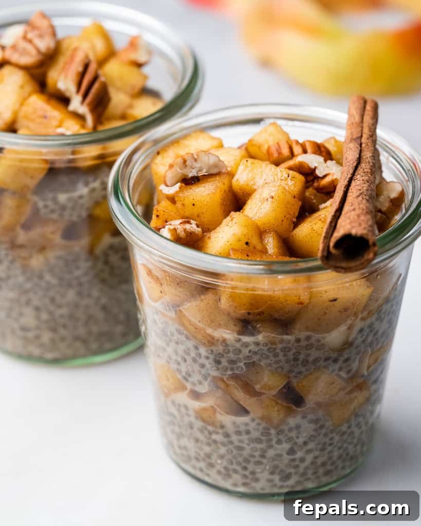 Spiced Apple Pie Chia Pudding 7 Side shot of apple pie chia pudding in a jar, beautifully topped with cinnamon-spiced apple mix