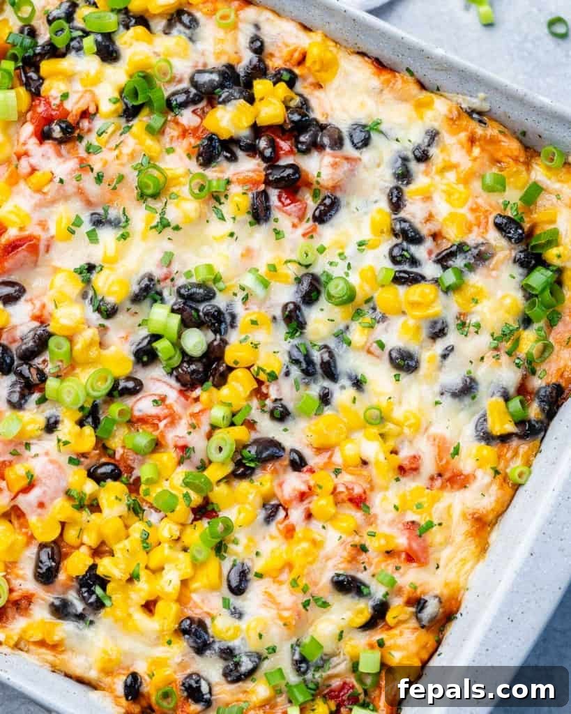 Cheesy casserole with black beans, corn and chicken.