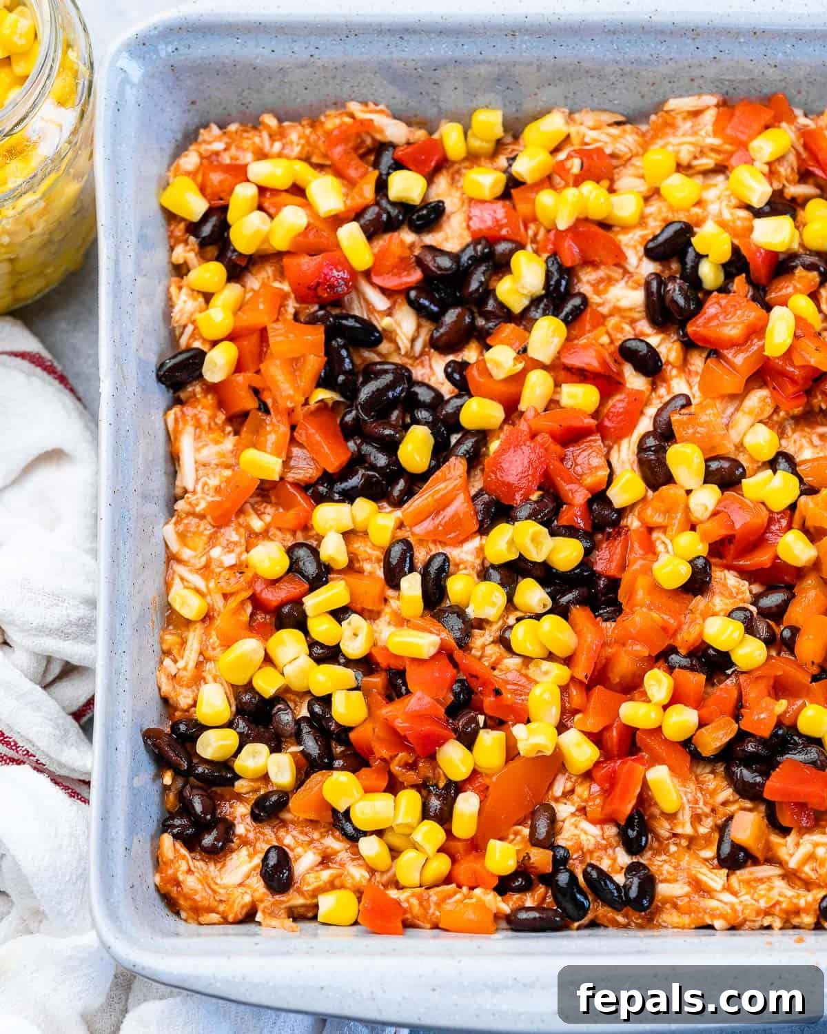 Layering ingredients in a pan.