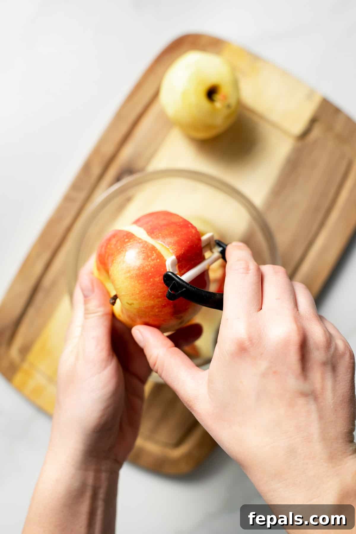 peeling an apple with peeler