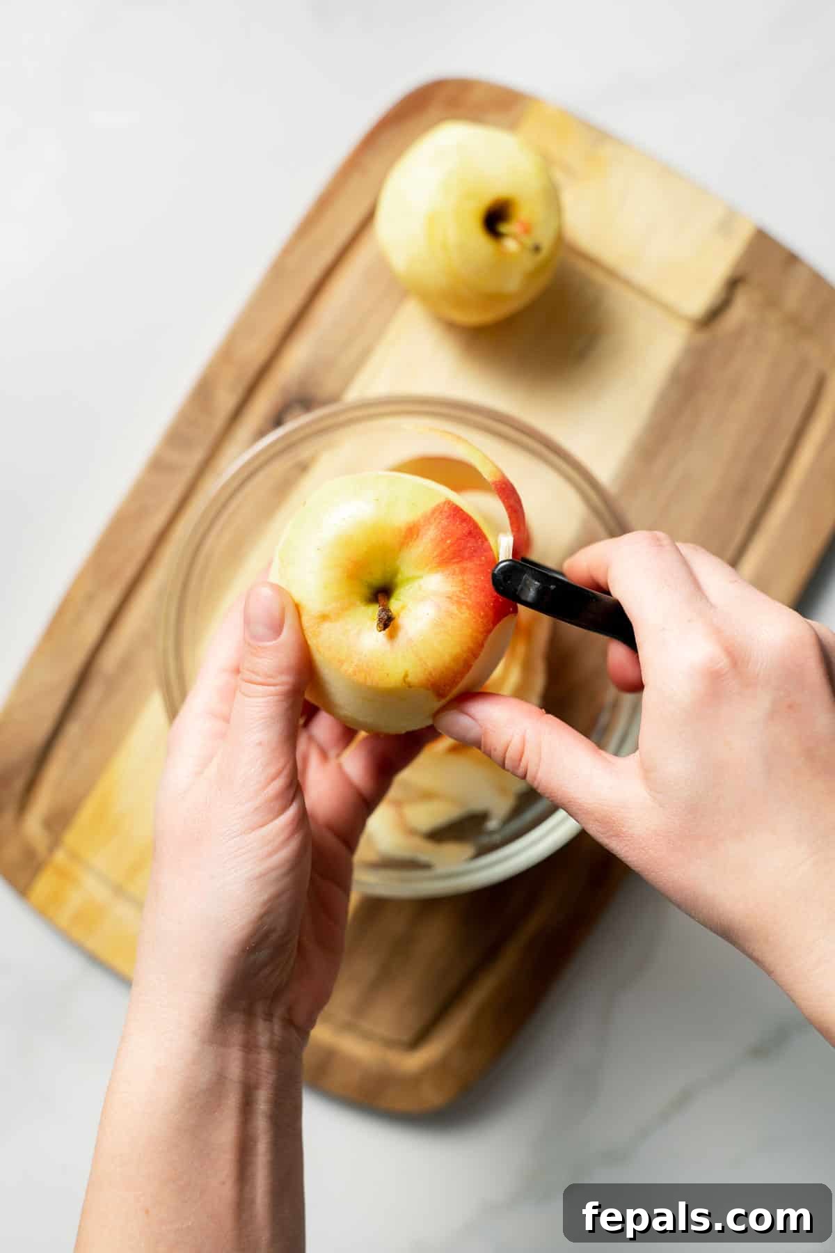 peeling an apple with peeler