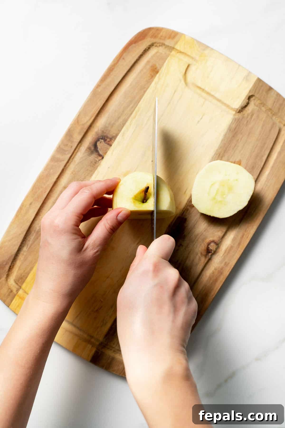 slicing an apple with a knife