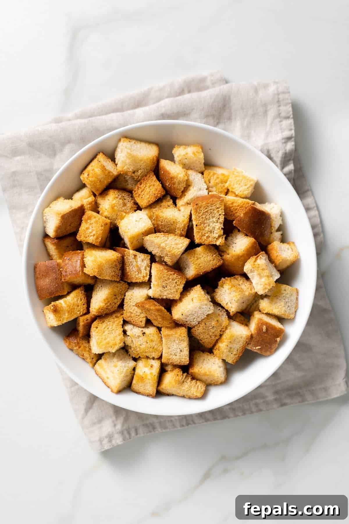 How To Make Croutons one white bowl filled with baked croutons