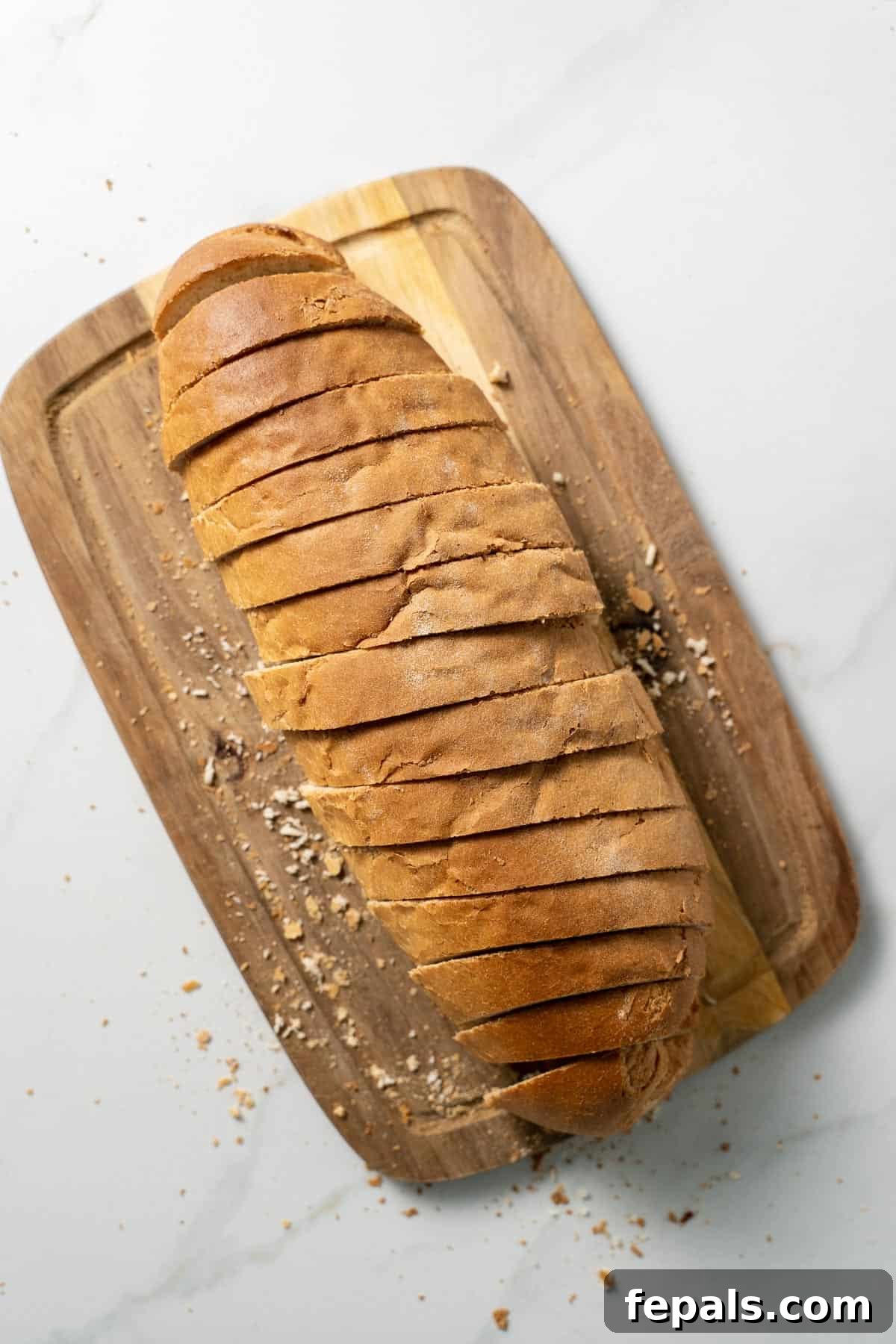 How To Make Croutons sliced loaf of bread atop cutting board