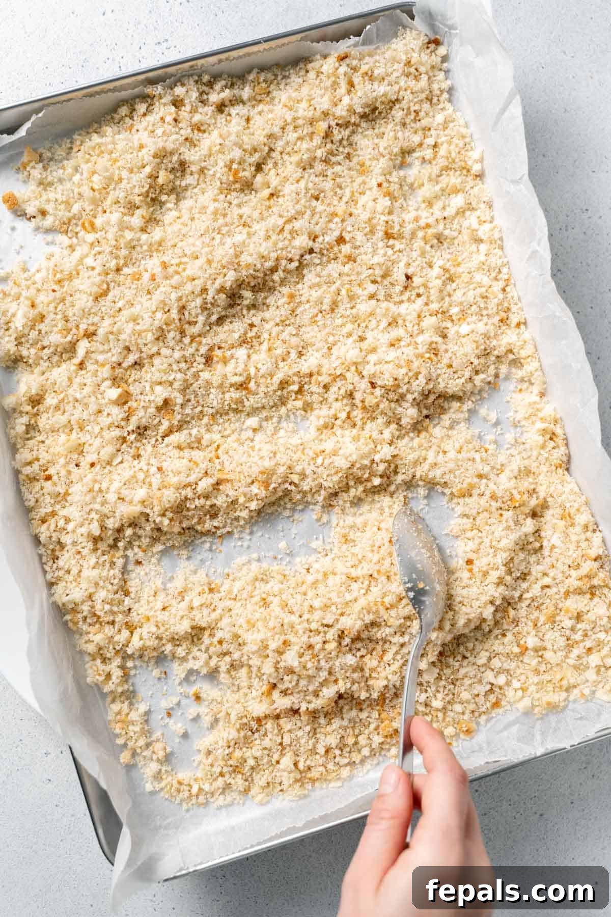 Homemade Breadcrumbs mixing bread crumbs with spoon