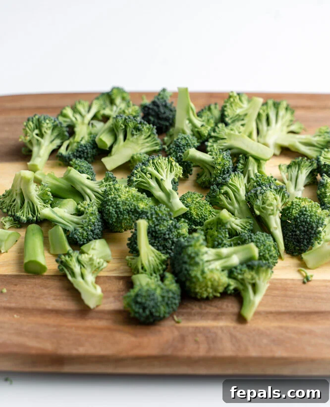 How to Perfectly Cut Broccoli 16 Broccoli florets on a cutting board.