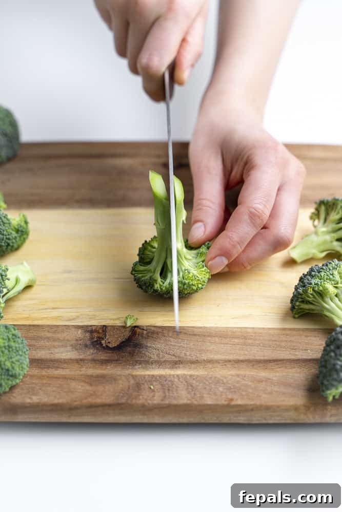 How to Perfectly Cut Broccoli 10 Slicing through a broccoli floret.