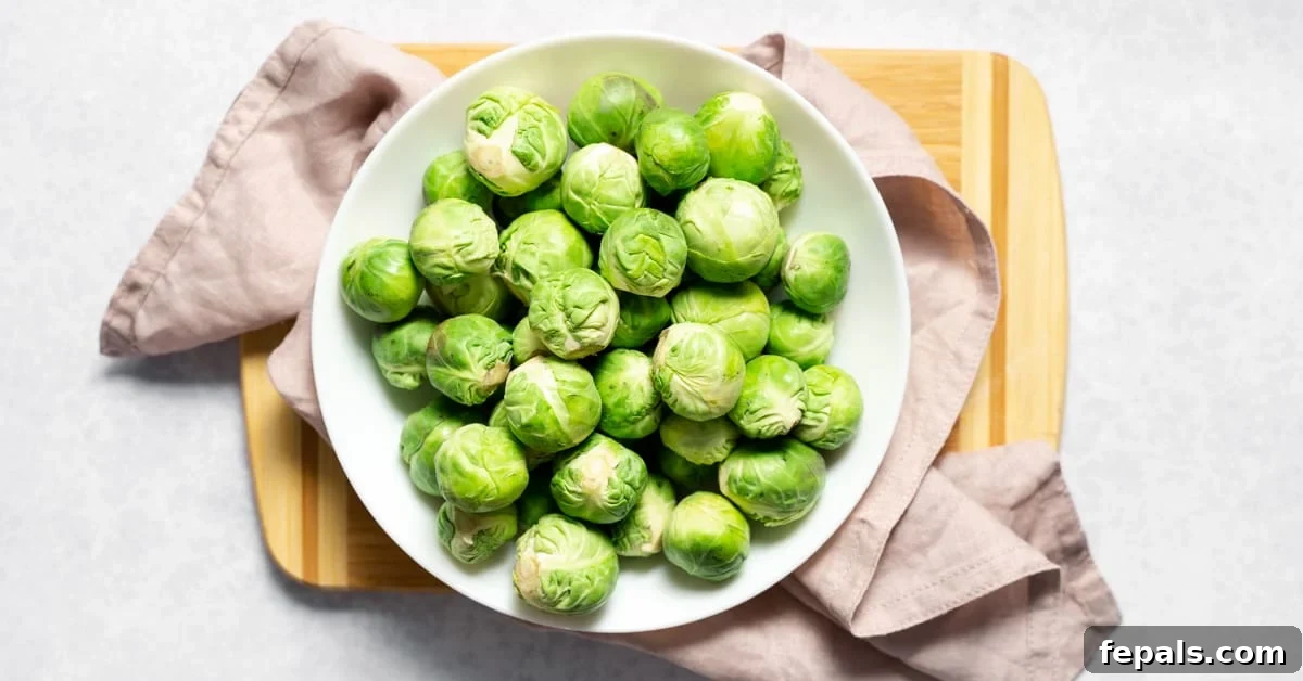 How To Cut Brussels Sprouts Bowl filled with fresh, whole Brussels sprouts, ready for preparation