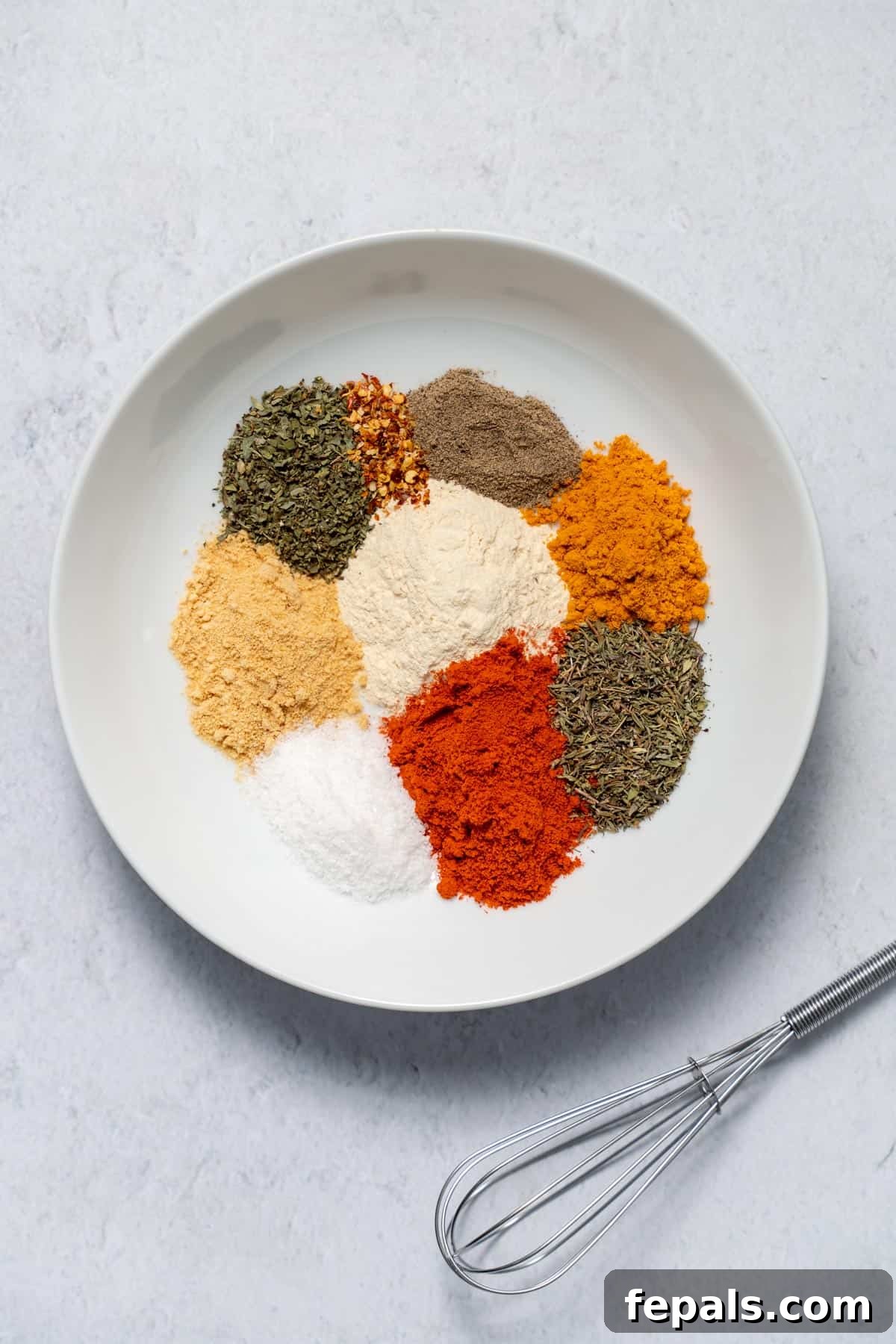 spices in bowl with whisk to the side