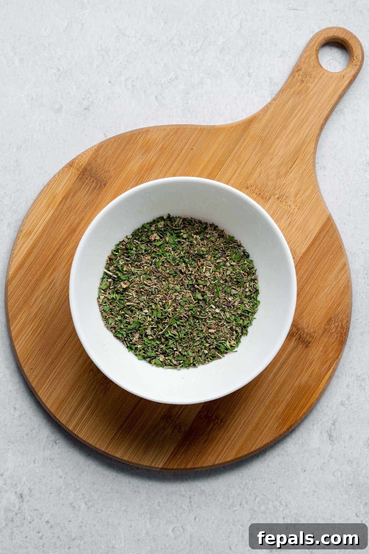 DIY Italian Seasoning Mix bowl filled with dried herbs