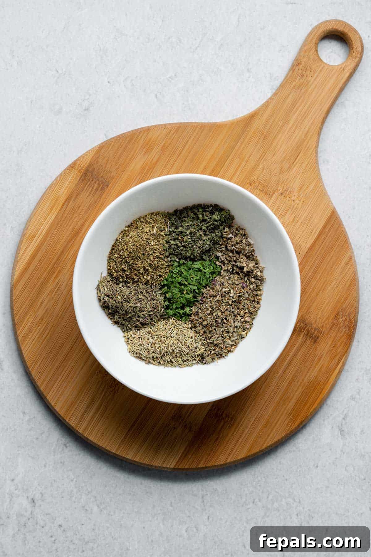 DIY Italian Seasoning Mix dried herbs in white bowl