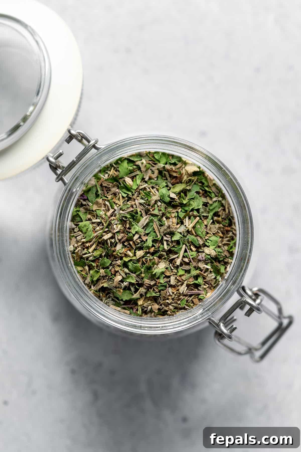 Homemade Italian Seasoning jar filled with dried herbs
