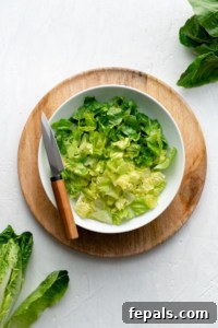 white bowl filled with romaine