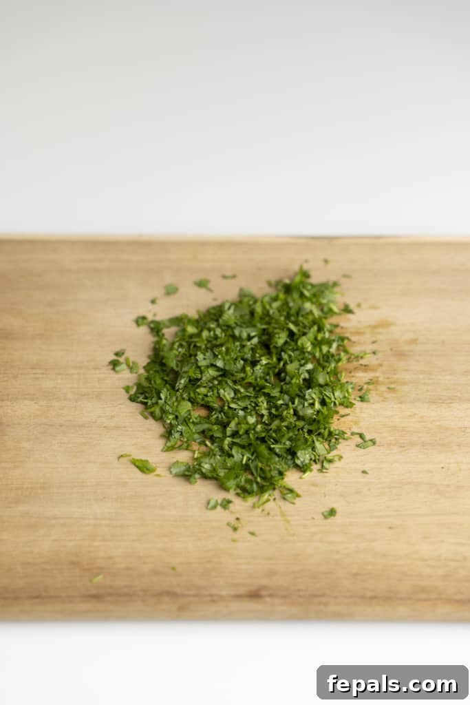 Chop Cilantro Like a Pro 2 chopped cilantro atop cutting board