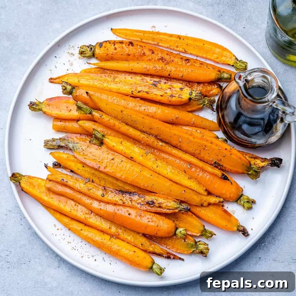 Honey-Kissed Balsamic Roasted Carrots 8 top view of glazed carrots on a round white plate