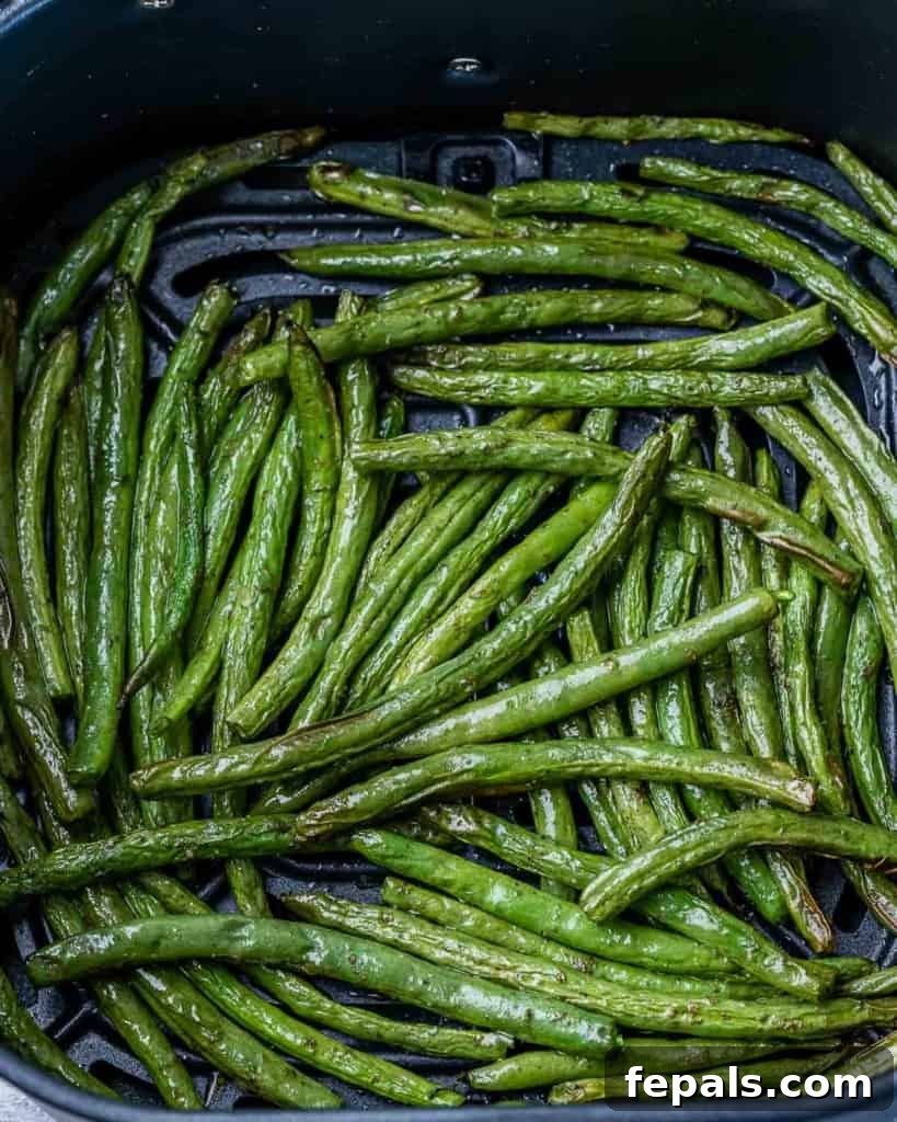 green beans laid out in the air fryer basket