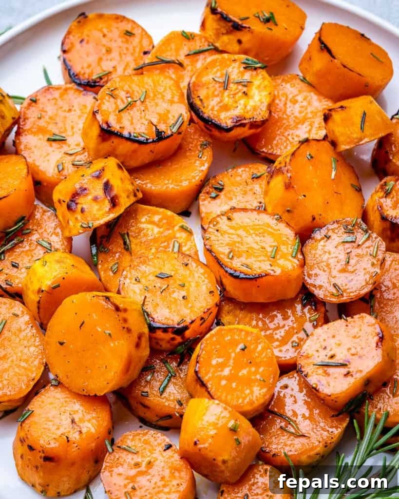 Caramelized Sweet Potatoes 3 Rounds of roasted sweet potatoes served with fresh rosemary.