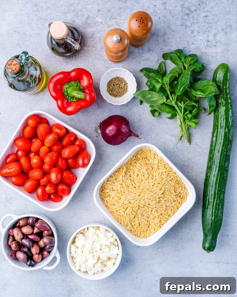 Zesty Greek Orzo Salad 4 Assortment of fresh ingredients for Greek Orzo Pasta Salad, including orzo, vegetables, feta, and olives.