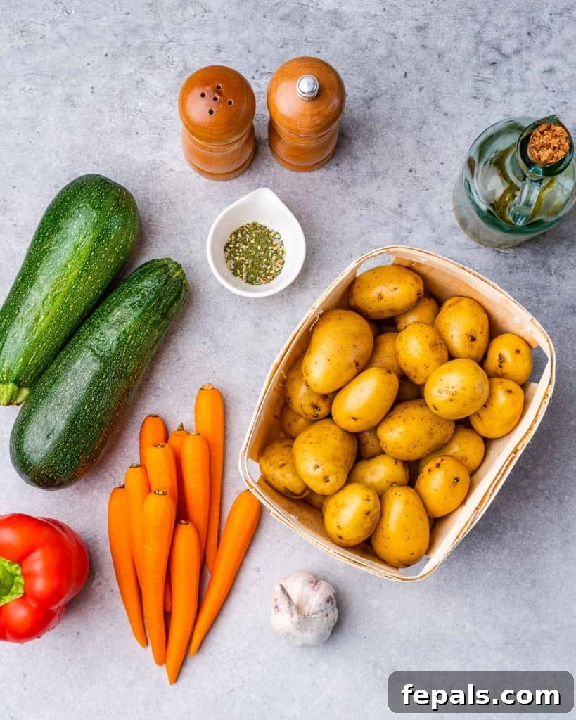 Raw vegetables – zucchini, garlic, bell pepper – ready for roasting.