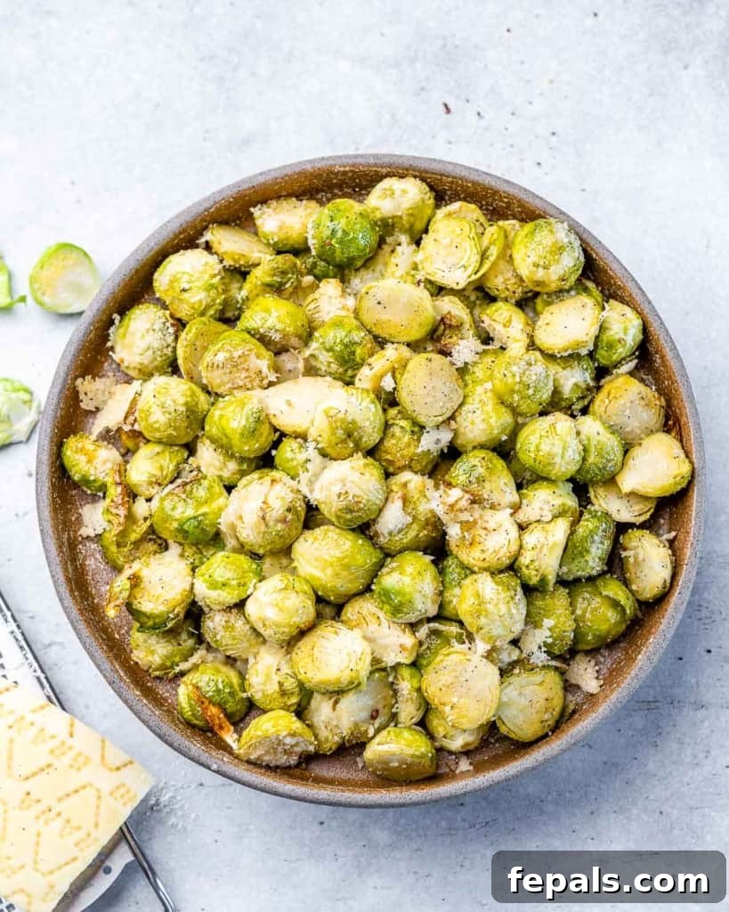 Oven Roasted Brussels sprouts in a large serving bowl.
