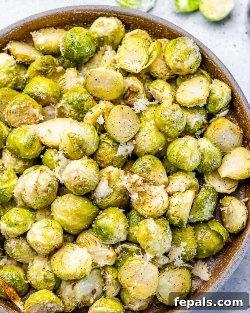 Roasted Brussels sprouts topped with garlic and parmesan cheese.