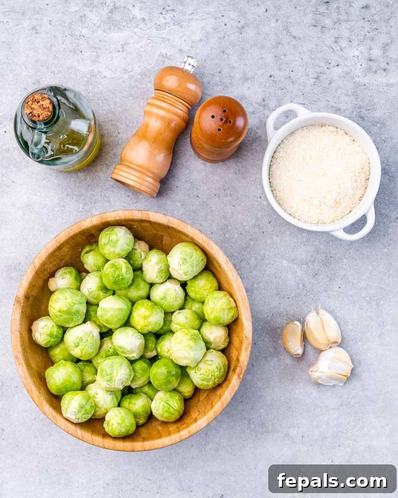 Brussels sprouts and a bowl of parmesan cheese.
