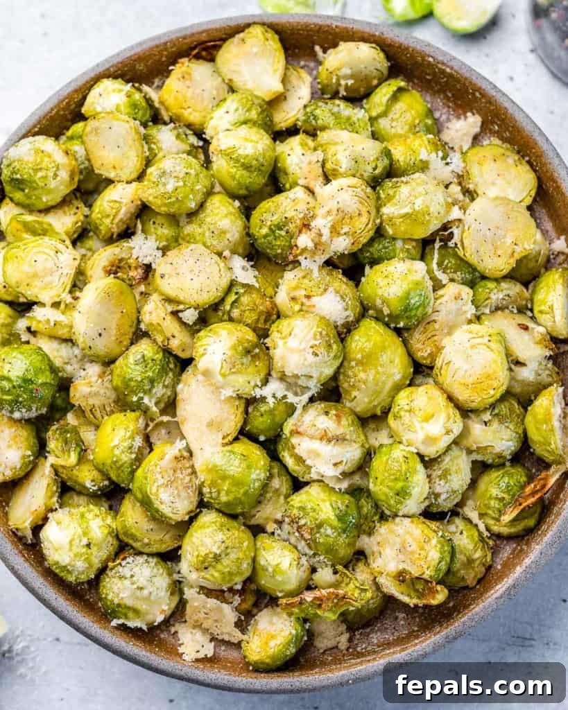 Oven Roasted Brussels sprouts topped with parmesan cheese.