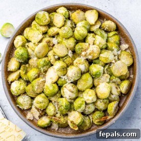 top view roasted brussel sprouts in a brown bowl