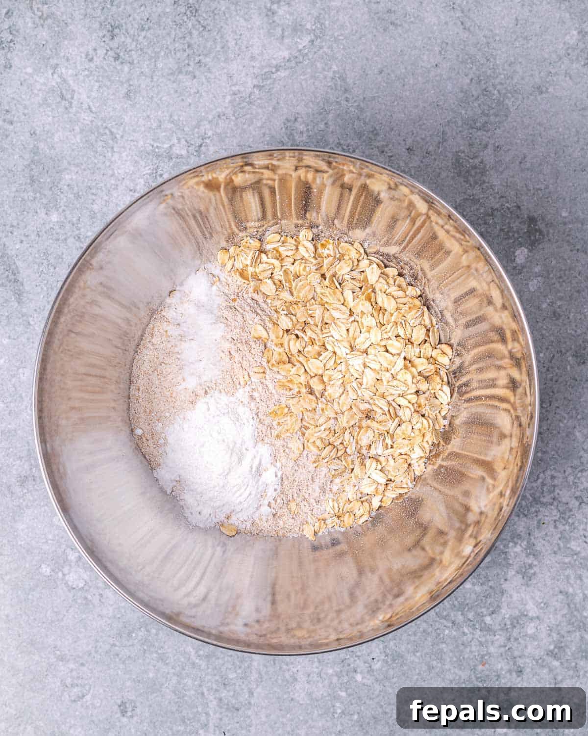 Mixing dry ingredients in a large bowl.