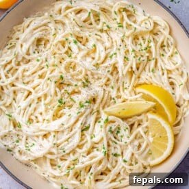 Luscious Vegan Lemon Pasta 12 Pasta in a skillet with lemon slices.