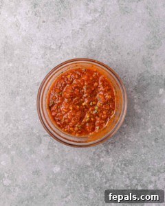Skillet Peri Peri Chicken: Creamy & Zesty 16 Tomato marinade sauce in a small bowl.