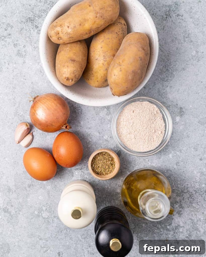 Timeless Golden Potato Fritters 4 Ingredients for potato pancakes portioned out on a white surface.