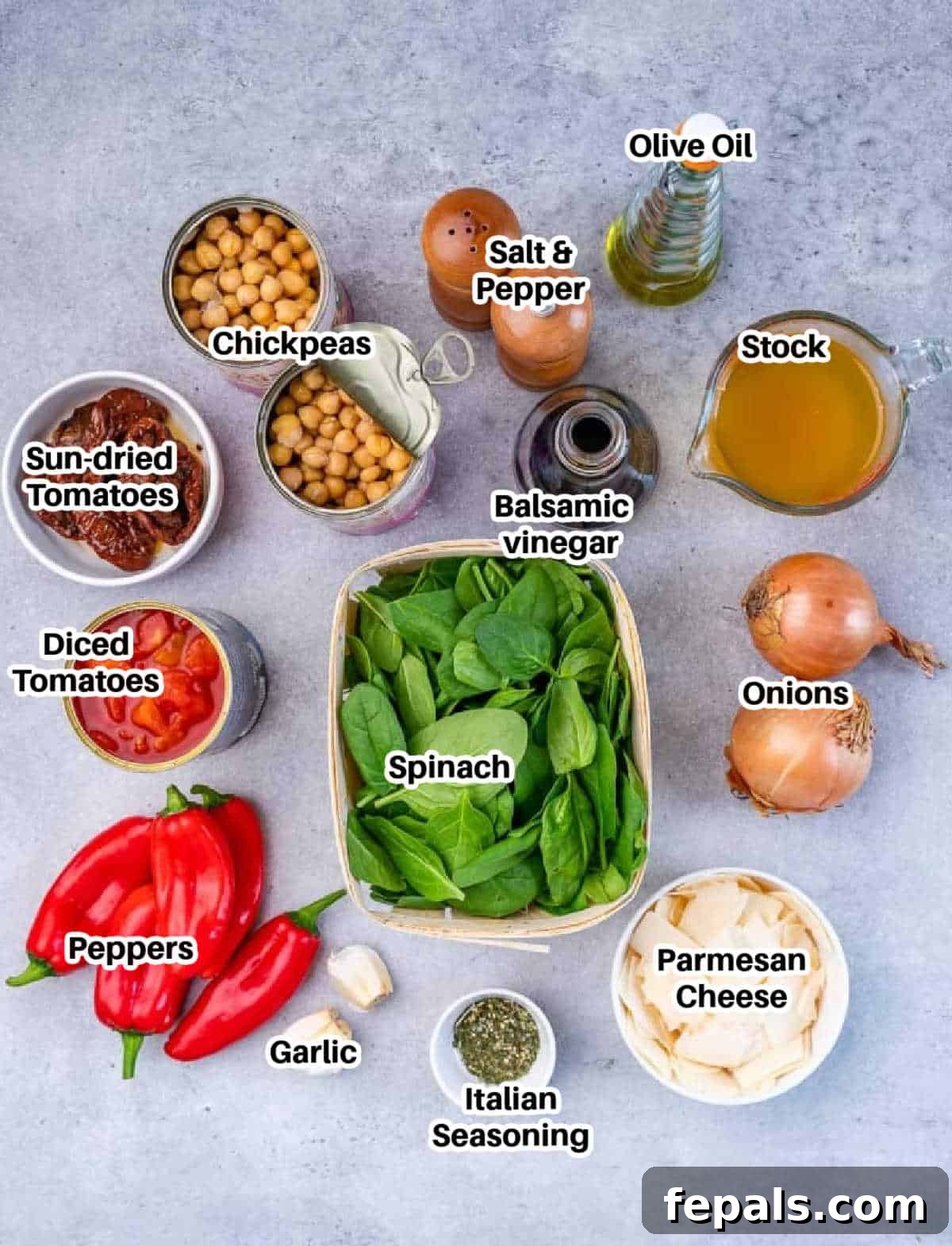Savory Chickpea and Vegetable Simmer 4 An organized flat lay displaying all the fresh, colorful ingredients needed to prepare the vegetarian chickpea stew, including vegetables, canned goods, and seasonings.