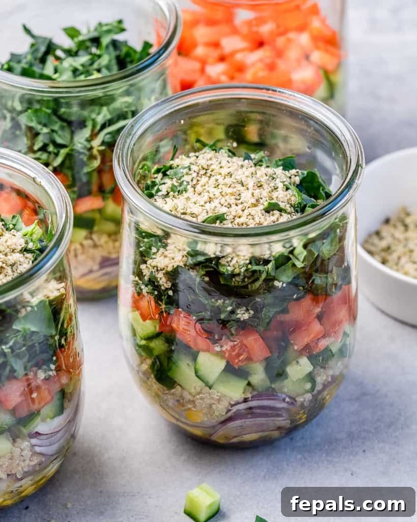 Tuscan Kale Power Jar 7 A perfectly layered Italian Kale Salad Jar, showcasing vibrant kale, quinoa, and tomatoes.