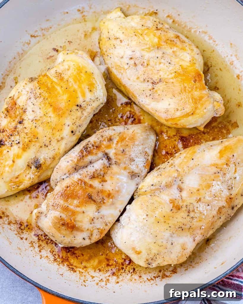 Engagement Skillet Chicken 5 Chicken breasts searing in a skillet.