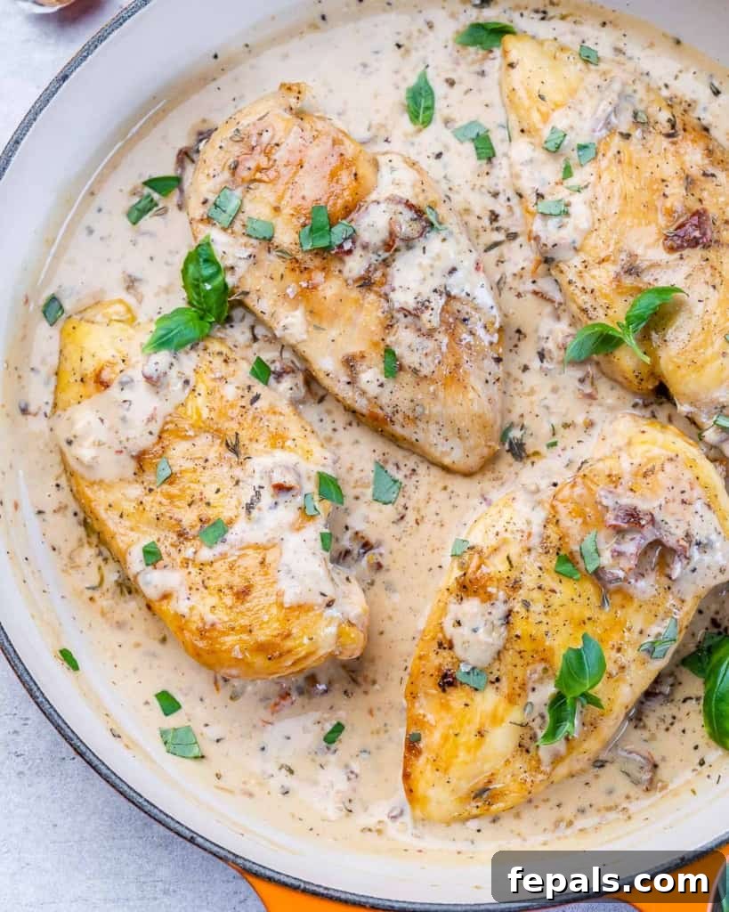 Engagement Skillet Chicken 9 top view chicken breast in a creamy white sauce, garnished with fresh herbs