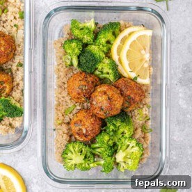 Savory Garlic Chicken Meatball Bowl 13 top view of glass bowl with quinoa topped with chicken meatballs and broccoli