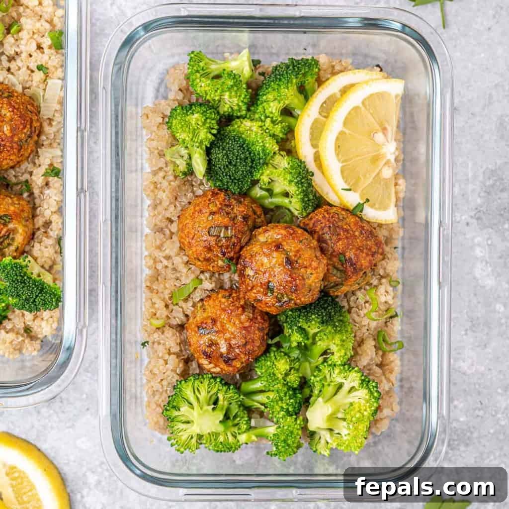 Savory Garlic Chicken Meatball Bowl 3 top view of glass bowl with quinoa topped with chicken meatballs and broccoli