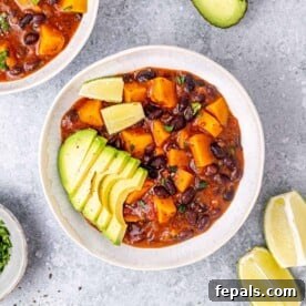 sweet potato bean stew in a white round bowl.