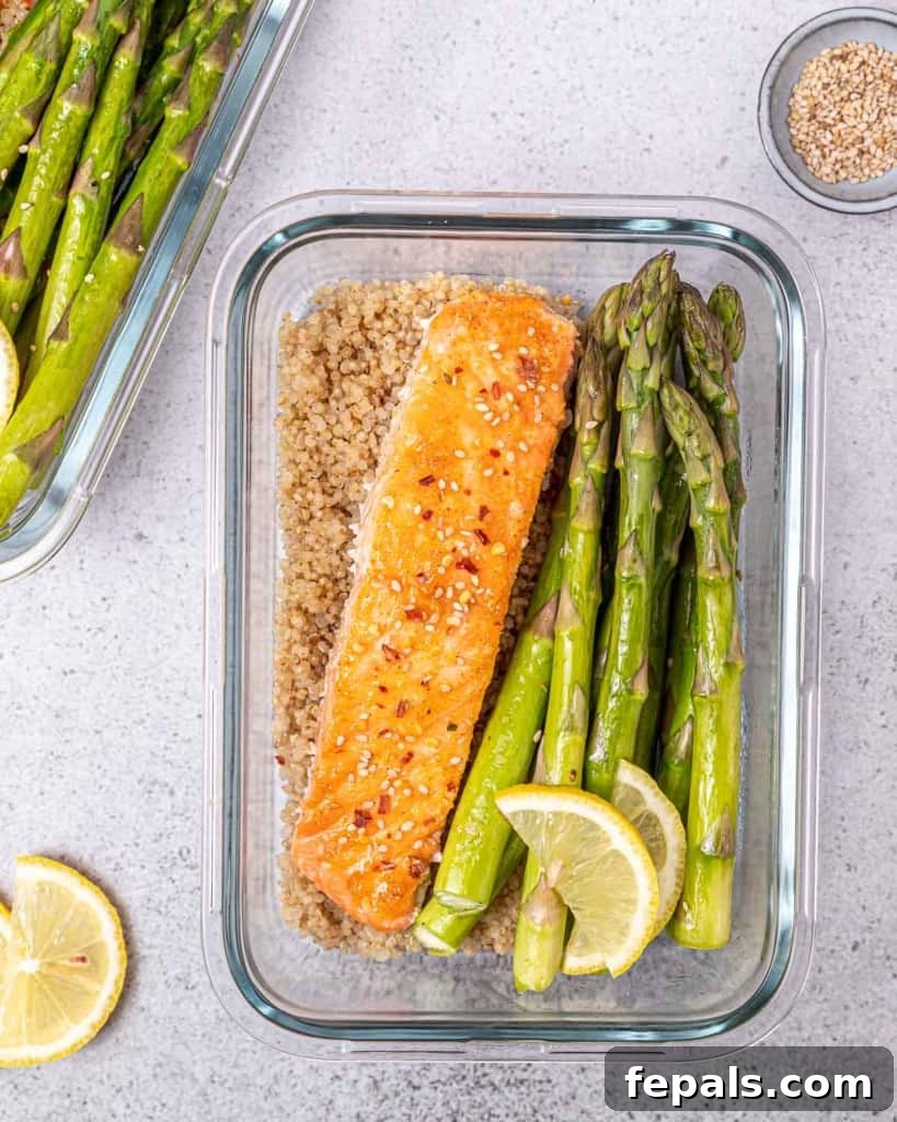 top view salmon in a bowl with quinoa and asparagus 